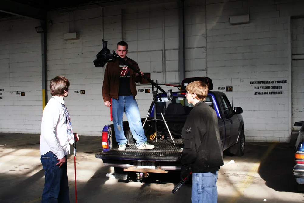 Alexander Jeffery, Kyle Stebbins, and myself trying to figure out what we were doing. Fun fact: my Dad's purple truck there is still kicking in 2026.